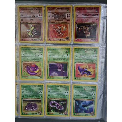 340 - A box containing two binders of vintage 1990s Pokemon cards together with a vintage Pokemon marble b... 