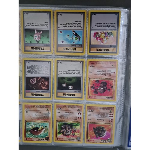 340 - A box containing two binders of vintage 1990s Pokemon cards together with a vintage Pokemon marble b... 