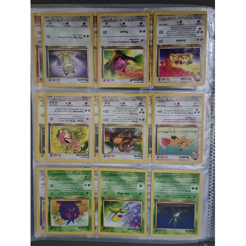 340 - A box containing two binders of vintage 1990s Pokemon cards together with a vintage Pokemon marble b... 