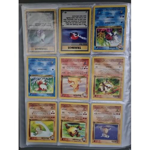 340 - A box containing two binders of vintage 1990s Pokemon cards together with a vintage Pokemon marble b... 