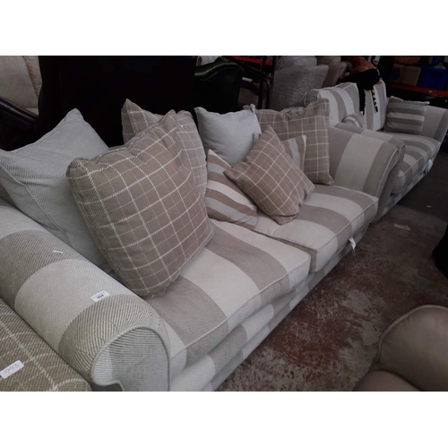 994 - A cream 3 seater sofa and matching 2 seater sofa with scatter cushions, from Stokers Ltd Southport.