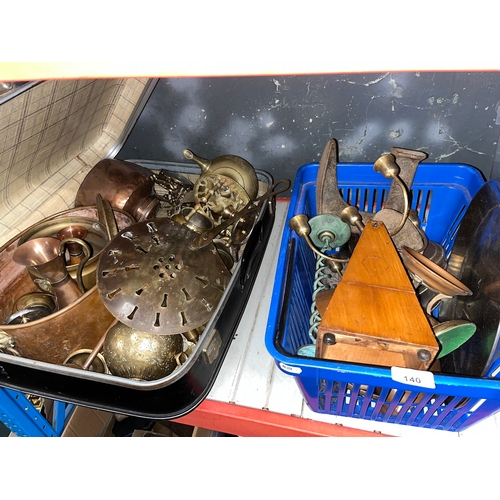 140 - A case and a box of brassware, metalware and a metronome, etc.