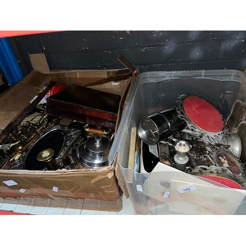 143 - Two boxes of metalware to include a part canteen of cutlery, brassware, etc.