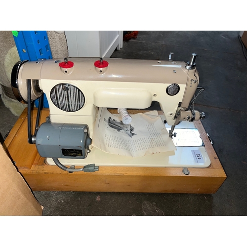 152 - A vintage Jones electric sewing machine with pedal, etc in original case.