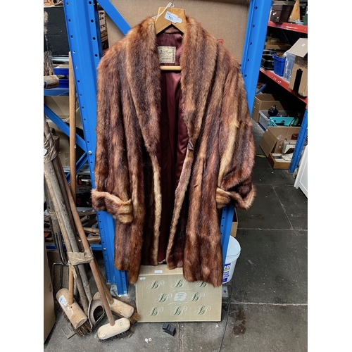 153 - A fur coat and a fur stole, etc.