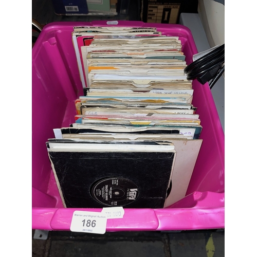 186 - A box of vinyl single records.