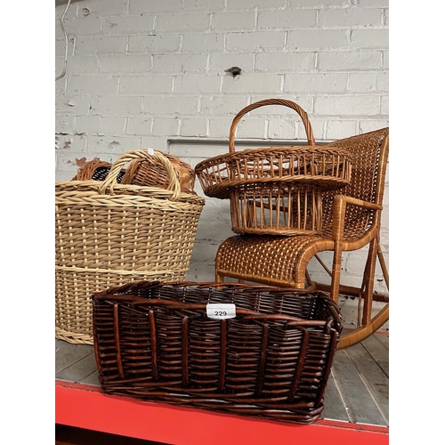 229 - Assorted baskets and a child's rocking chair.