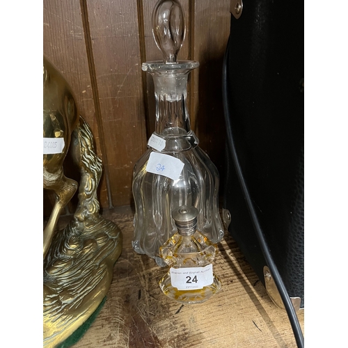 24 - A glass decanter together witha late Victorian cut glass scent bottle decorated with a dog.