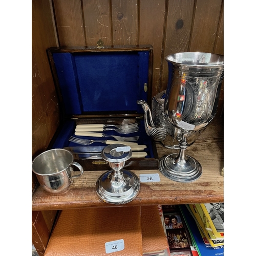 26 - A collection of EPNS ware to include tea pot, a large goblet, a cup, etc and a silver candlestick ho... 