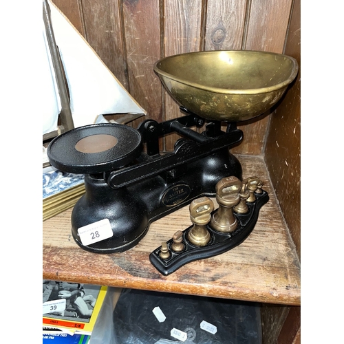 28 - A set of Salter Staffordshire kitchen scales with a set of Brass Bell weights on a Tray