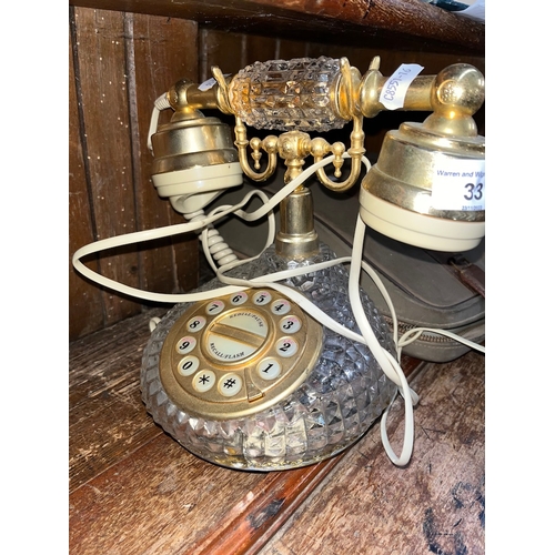 33 - A vintage cut glass telephone.