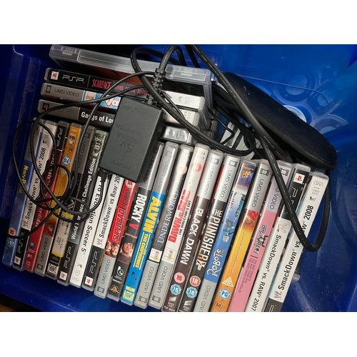 53 - A PSP console and approx. 74 games.