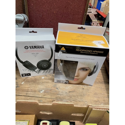 84 - A pair Behringer multi-purpose headphones and a pair of Yamaha headphones.