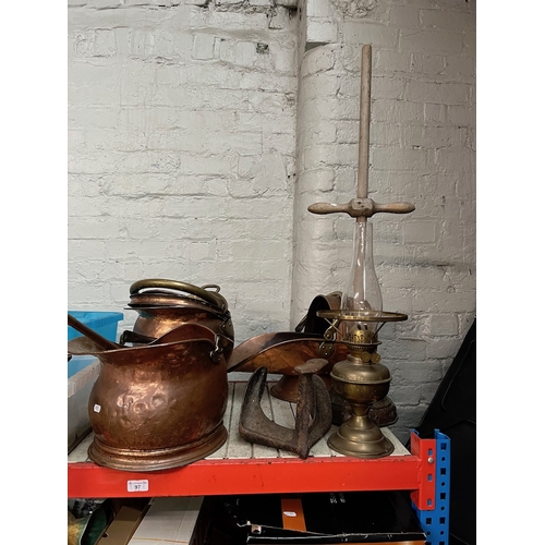 97 - 4 copper and 1 brass coal buckets, a posser, a parafin lamp, a shoe last, a bed warming pan, a butte... 