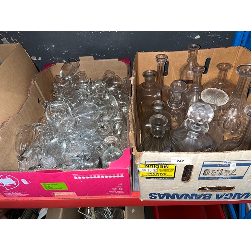 247 - A box of decanters and a box of drinking glasses