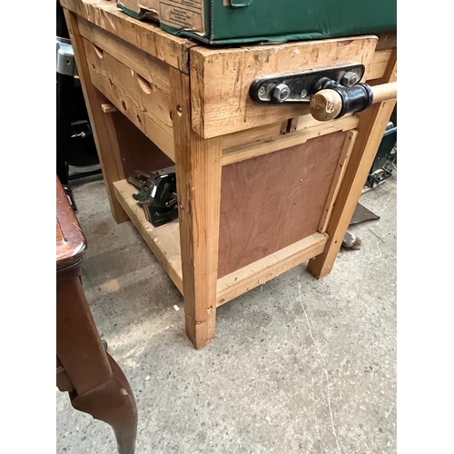 291 - A woodworking bench with vice and with drawers containing various tools to include planes, chisels, ... 