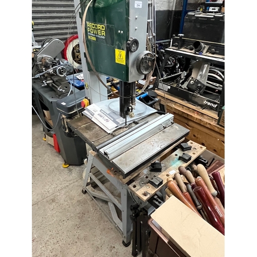 294 - A Record Power BS300 bandsaw with accessories together with a workbench.