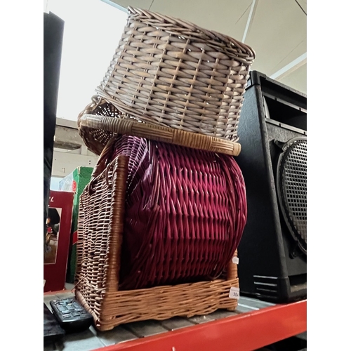 304 - A collection of various wicker baskets, hamper basket etc.