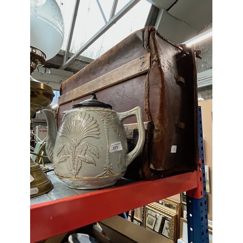 311 - A leather case and a large Victorian teapot.