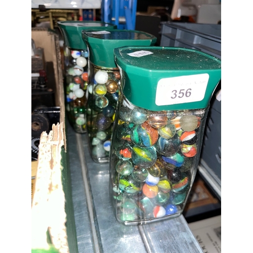 356 - Three jars of marbles.