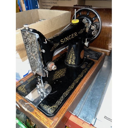 366 - A  hand cranked cased Singer Sewing machine, (no key to the case)