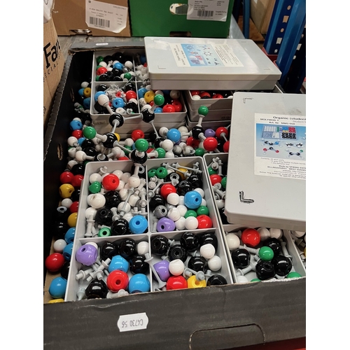 381 - A box of molecular model kits/parts.