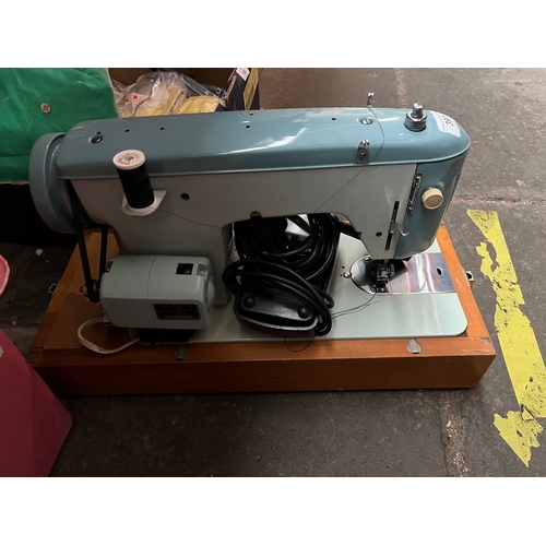 397 - A cased Brother electric sewing machine with power lead and pedal etc