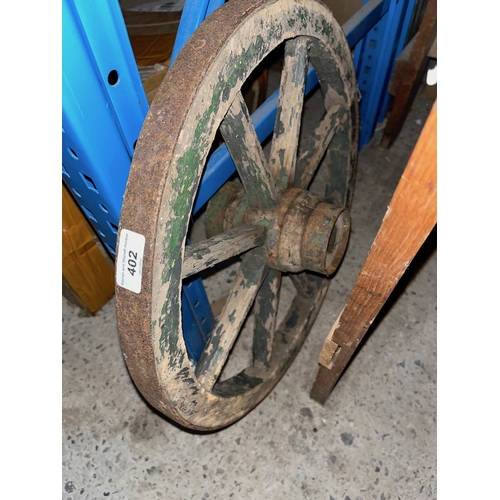 402 - A vintage small wooden cart wheel.