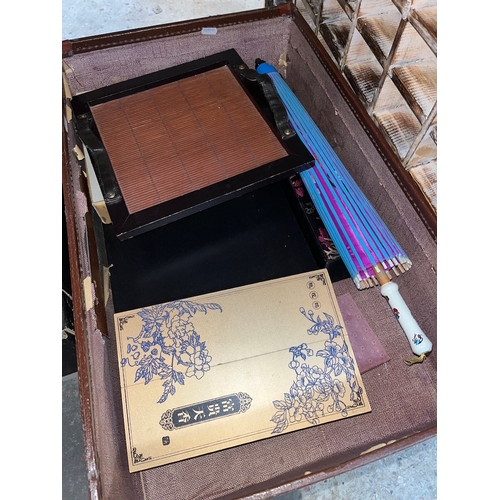 450 - A mixed lot of oriental items including Japanese sushi set, Chinese calligraphy set, Chinese chop st... 