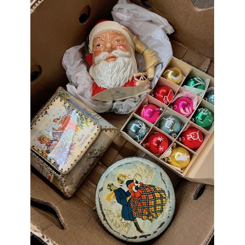 457 - A box of Christmas items including vintage tin and vintage box containing old glass baubles, a box o... 