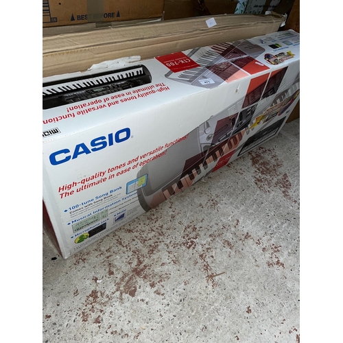 471 - A boxed Casio CTK-700 electronic keyboard with stand