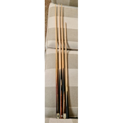 117 - Quantity of snooker cues, cased and loose & 2 hockey sticks