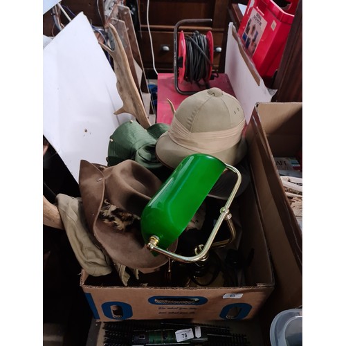 60 - A box containing a desk lamp, a set of antlers and Headware, including a Pith Helmet, an Austrakian ... 