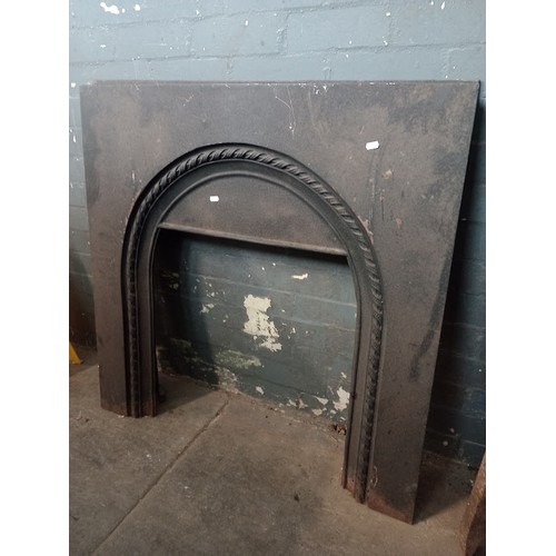 1013 - A cast iron fireplace insert.