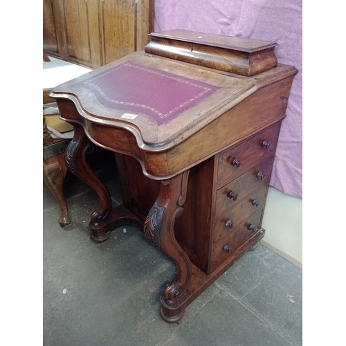 1010 - A Victorian walnut Davenport desk.