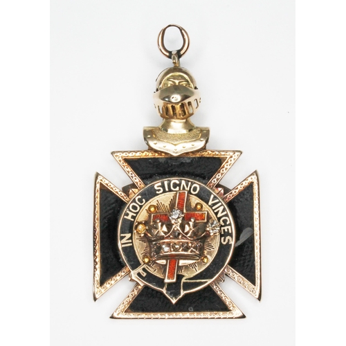 78 - A Masonic type medallion formed as a black onyx cross mounted with a diamond set crown, red enamel c... 