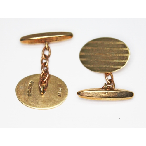 94 - A pair of hallmarked 9ct gold cufflinks, wt. 5.4g.