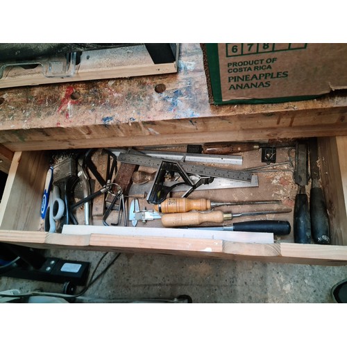 291 - A woodworking bench with vice and with drawers containing various tools to include planes, chisels, ... 