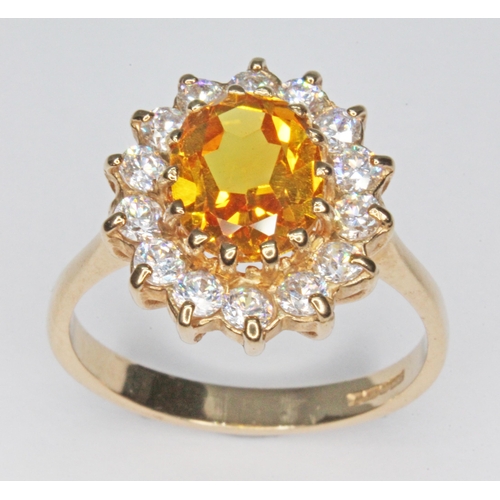 114 - A hallmarked 9ct gold synthetic yellow sapphire and colourless stone ring, gross wt. 3.9g, size Q.