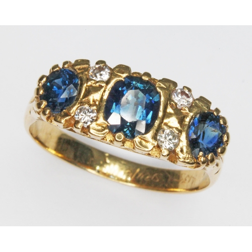 117 - A sapphire and diamond cluster ring, the oval cut sapphires weighing approx. 0.25ct, 0.64ct & 0.28ct... 