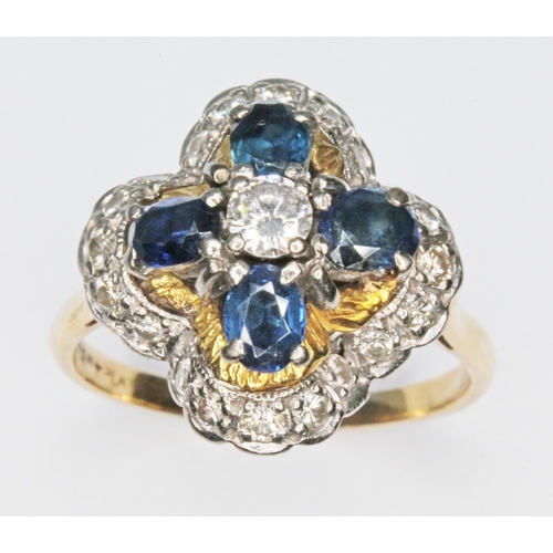 120 - A diamond and sapphire cluster ring, the cluster measuring approx. 16.92mm x  15.11, band marked '18... 