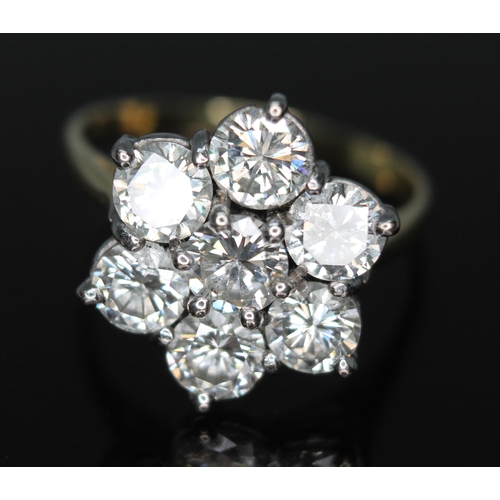 127 - A seven stone diamond ring, the modern round brilliant cut diamonds weighing approx. 3.15ct in total... 