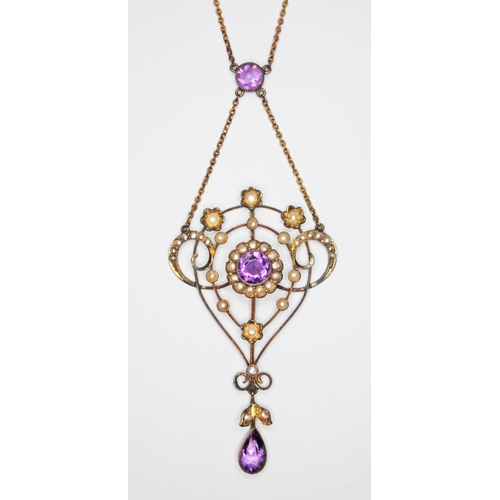 130 - An early 20th century amethyst and seed pearl pendant necklace, pendant marked '9ct', the chain '9',... 