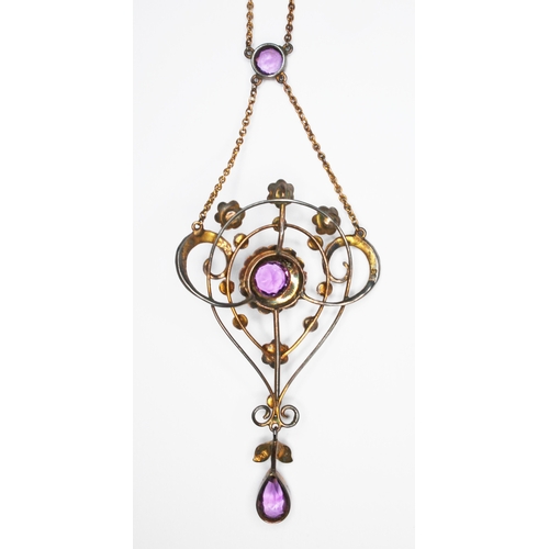 130 - An early 20th century amethyst and seed pearl pendant necklace, pendant marked '9ct', the chain '9',... 