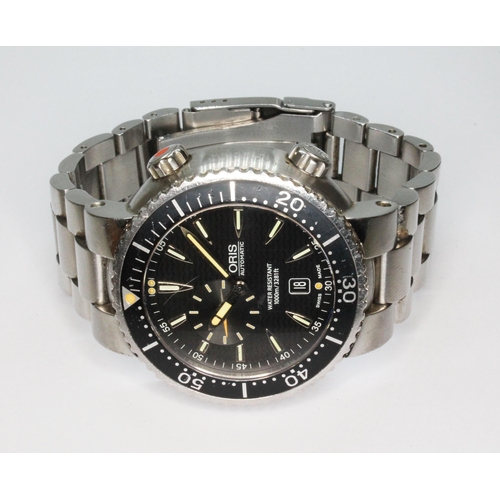 186 - An Oris Divers, ref. 7609, cal. 643, signed black dial, stainless steel case, diameter 46mm,, adjust... 