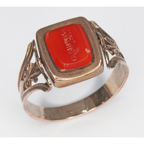 239 - A Georgian mourning ring, swivel panel set with a carnelian seal to one side and the other engraved ... 