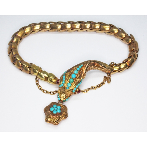 244 - A Victorian serpent bracelet, the head embellished with turquoise cabochons and garnet set eyes, the... 