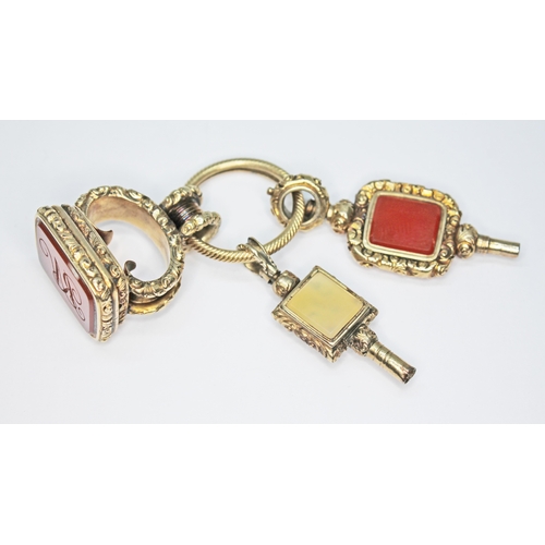 249 - A 19th century gold plated carnelian seal on yellow metal ring with two gold plated and quartz set w... 