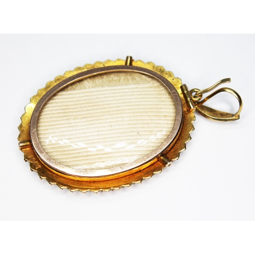 250 - A 19th century split pearl set oval pendant, length 48mm, marked '15ct', approx. gold wt. 5g.