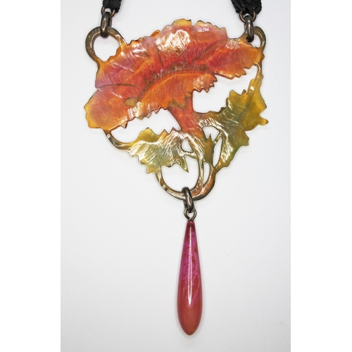 255 - A French Art Nouveau pressed and stained horn pendant, attributed to Georges Pierre GIP, with lower ... 